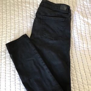 Distressed denim jeans